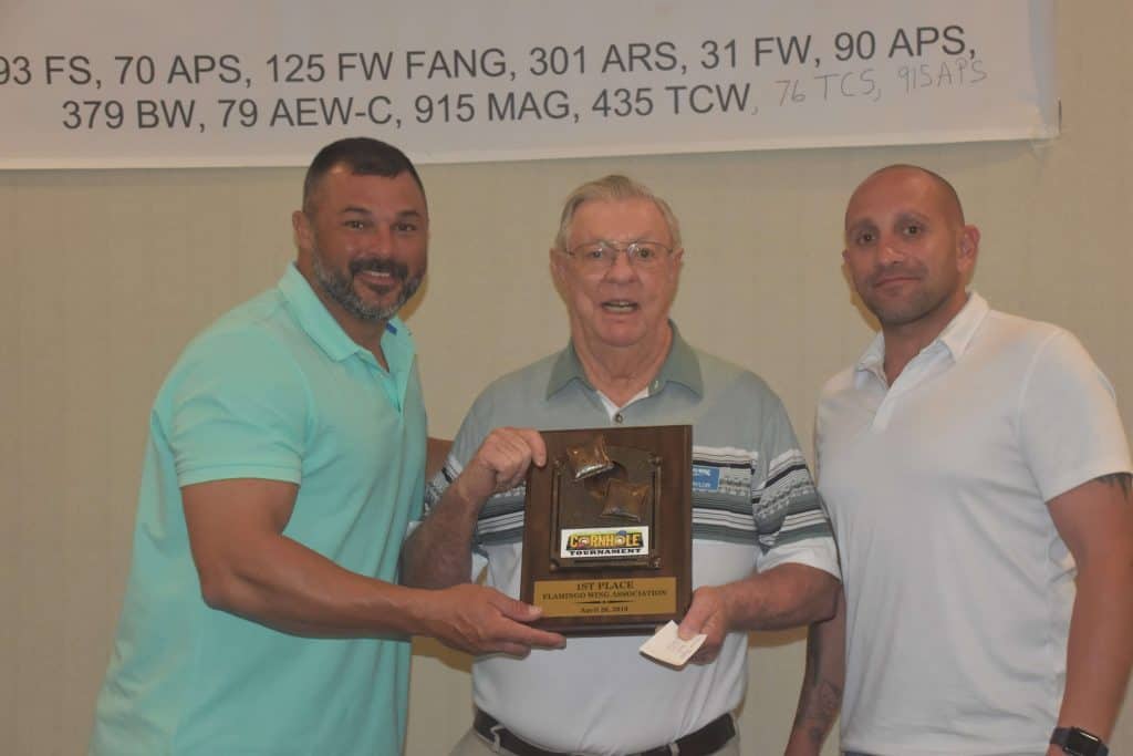 Herb, presenting the trophy to the 1st place winners of the cornhold tournament.